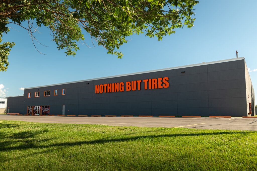 Nothing But Tires shop exterior with orange signage at 15935 118 Ave NW in Edmonton